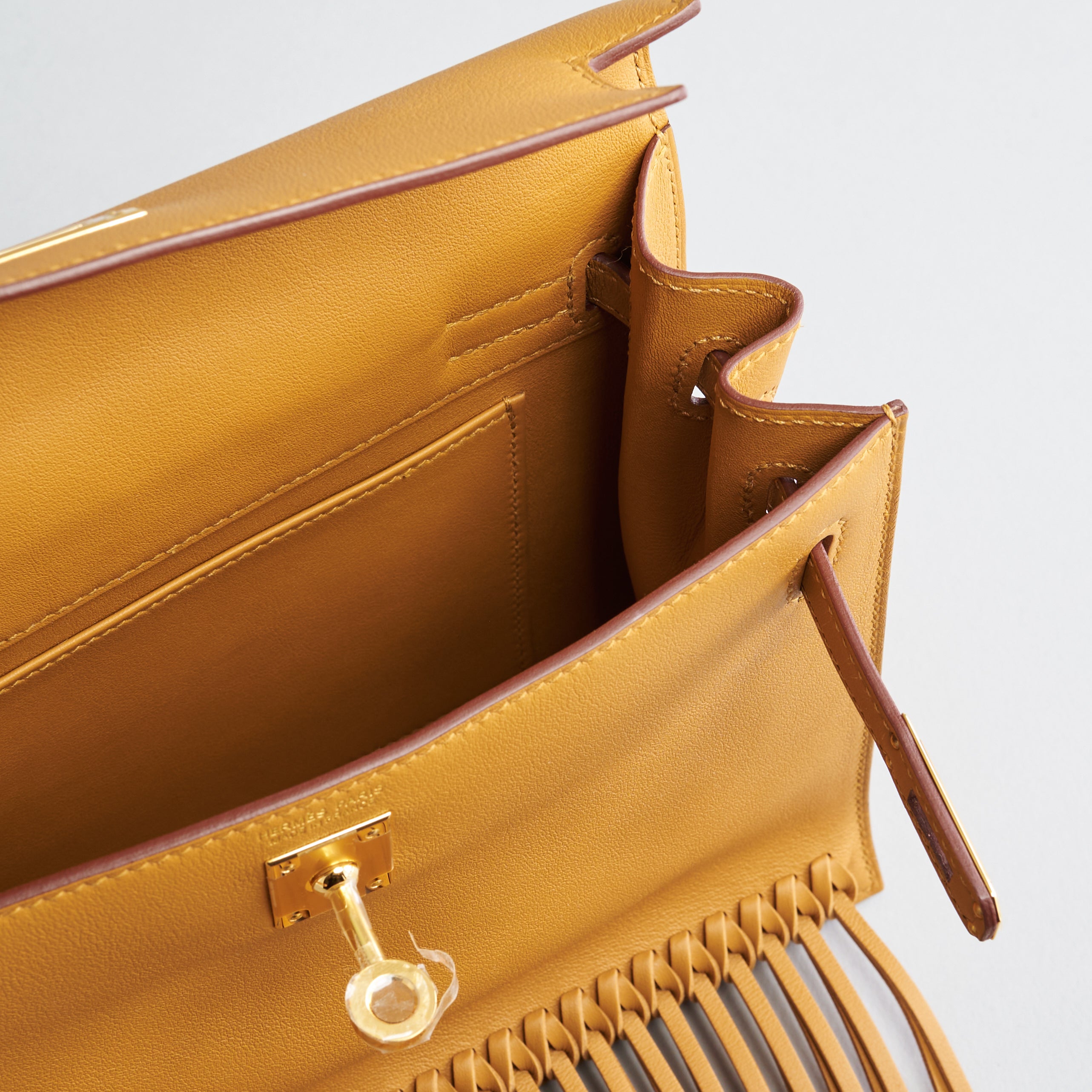 Hermès Kelly Danse II Anate w/ Fringe Swift Sesame Gold Hardware