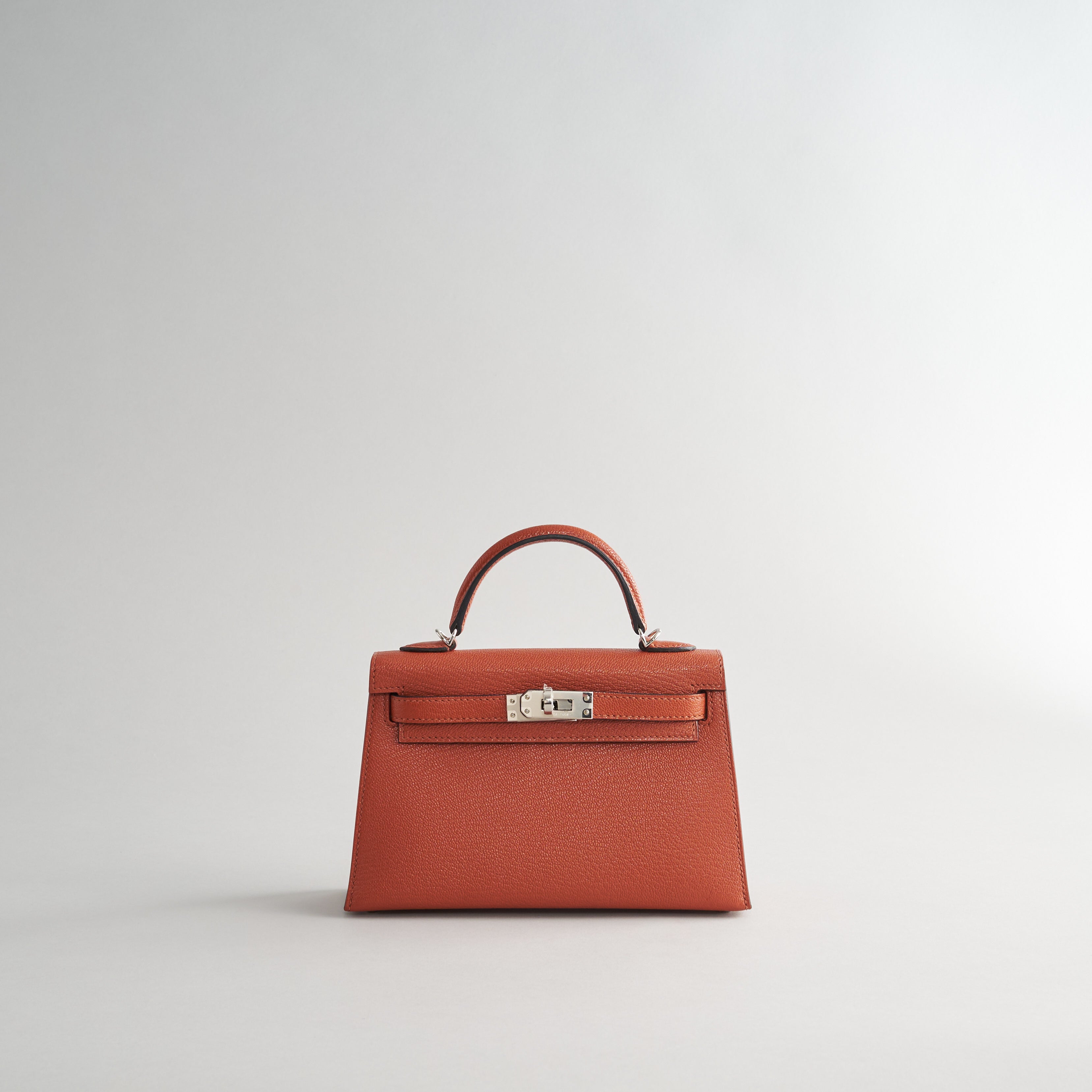 Hermès Kelly Mini Chevre Cuivre/Rose Mexico w/ Wool Strap Palladium Hardware